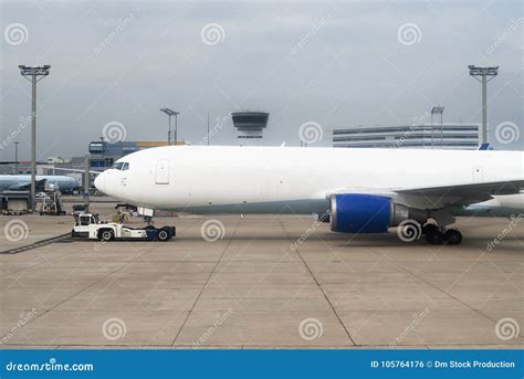 TUG Pushback Tractor with Aircraft. Stock Photo - Image of aircraft ...