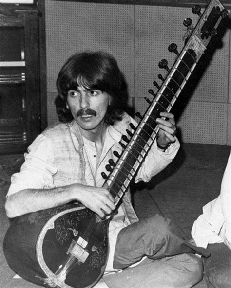 George Harrison The Beatles Playing Guitar by FamousFacesPhotos