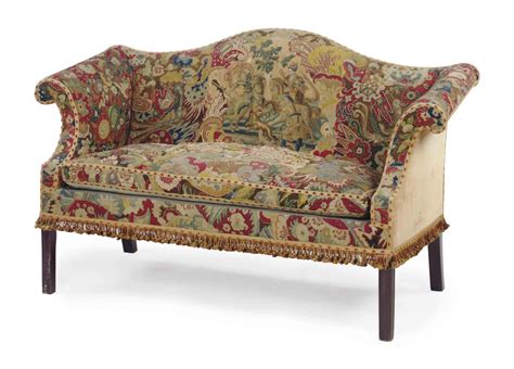 AN ENGLISH NEEDLEPOINT-UPHOLSTERED MAHOGANY CAMELBACK SETTEE, , THE ...