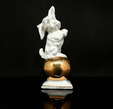 Dog on golden ball - Art Deco group - Catawiki