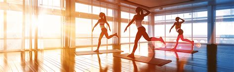 A Group Of Beginners Practicing Basic Yoga Poses In Studio Background ...