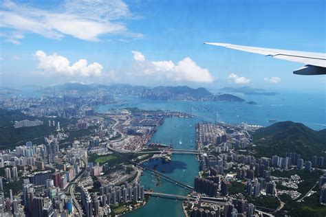 Aerial View of City Through Airplane Window · Free Stock Photo