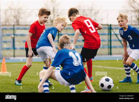 Kids Playing Soccer At School