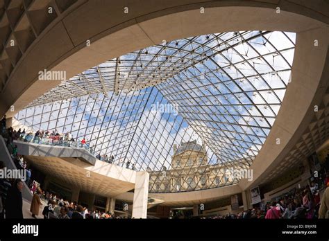 Musee du Louvre Museum interior of Pyramide in spring sunshine Paris ...