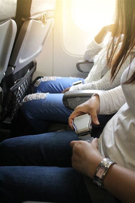 Airplane seat belt. stock image. Image of female, trip - 101750371