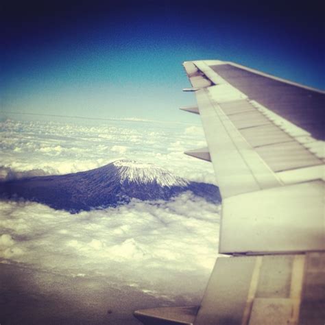 Mount Kilimanjaro from 30k feet. Birds eye view, snow and cloud ...