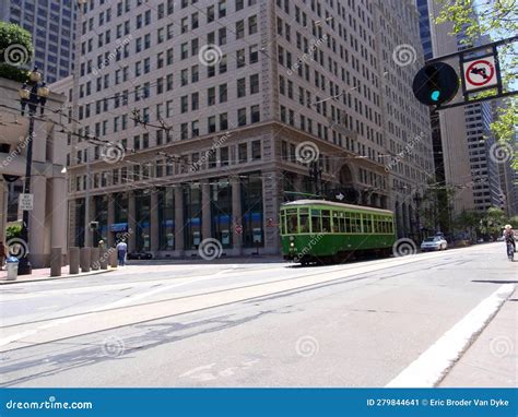 A Green Cable Car and a Biker on Market Street, One of the Main ...