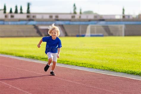 Child Running in Stadium. Kids Run. Healthy Sport Stock Image - Image ...