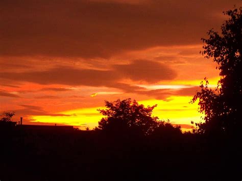 Orange Red And Yellow Sunset Photograph by Corinne Elizabeth Cowherd