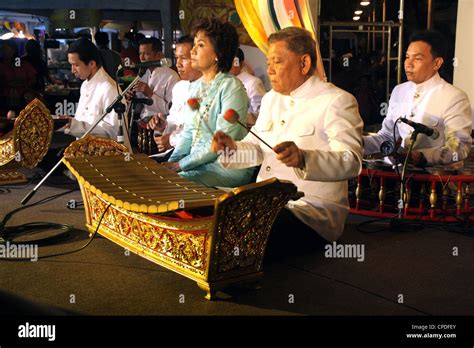 Thai musician performing a Ranat Ek (traditional Thai xylophone) on ...