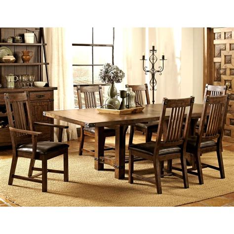 This rustic mission style dining set features a solid wood construction ...