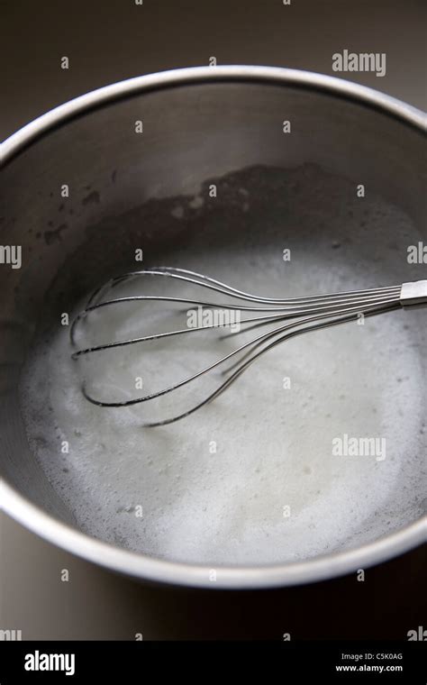 Whisking egg whites Stock Photo - Alamy