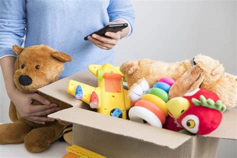 Volunteer Holding Donation Box with Old Toys. Stock Image - Image of ...