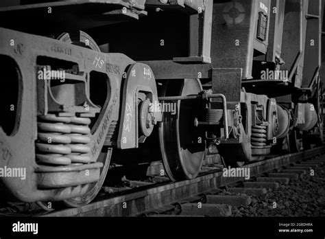 Grayscale closeup of train wheels Stock Photo - Alamy