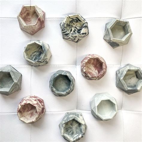 several different shapes and sizes of hexagonal objects on a white ...