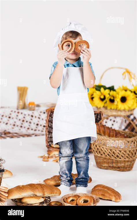 Boy chef cooking in the kitchen Stock Photo - Alamy