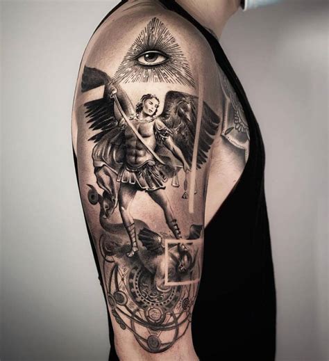 Black and grey St Michael Archangel tattoo on the upper