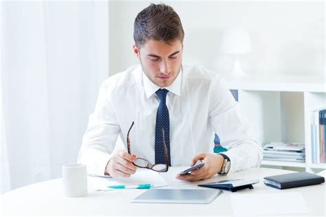 Free Photo | Young handsome man working in his office.