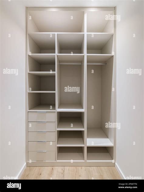 New built-in furniture in a small dressing room. Modern storage room ...