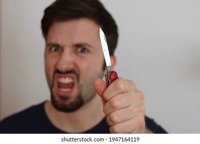 Angry Young Man Holding Knife Stock Photo 1947164119 | Shutterstock