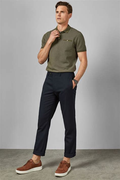 Men's tucked in polo shirt, chinos and sneakers outfit. For more men's ...