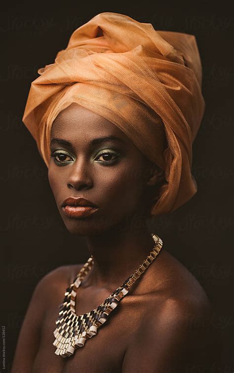 "African Woman With An Orange Turban" by Stocksy Contributor "Lumina ...