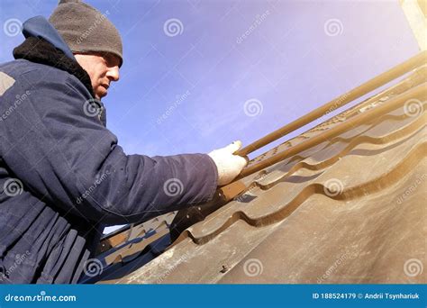 Installation by the Master on a Roof of the House of Snow Stops ...