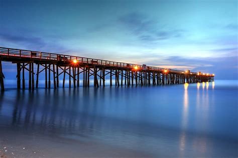 Flagler Beach Pier's Early Morning Light Photograph by Carol R Montoya