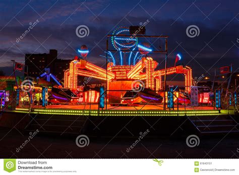 Carousels at night editorial photo. Image of machine - 61843151