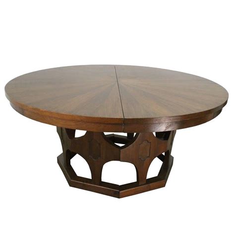 1960s Mid-Century Expandable Round Walnut Dining Table at 1stdibs