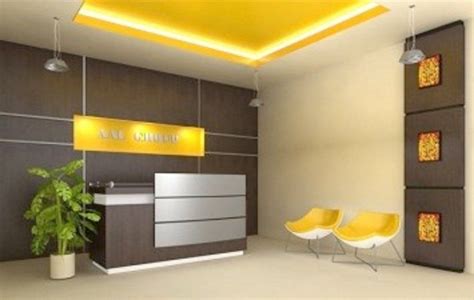 the interior of a modern office with yellow chairs and a reception desk ...