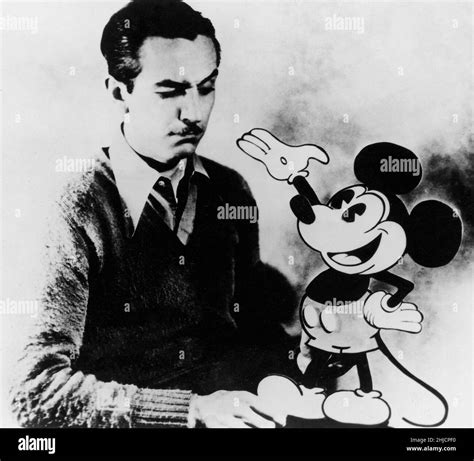 American animator Walt Disney (1901-1966) with the character of Mickey ...