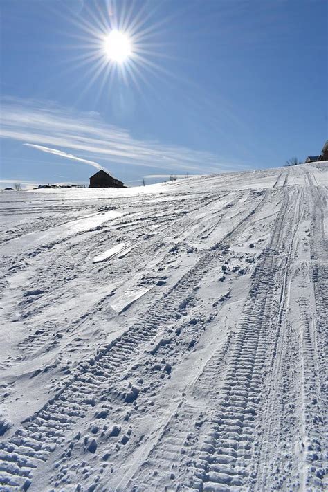 Snowmobile tracks in a field Photograph by Claude Laprise - Fine Art ...