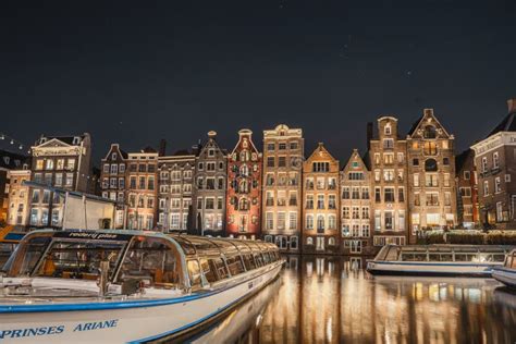 Dancing Houses on Damrak in Amsterdam Holland during the Evening and ...