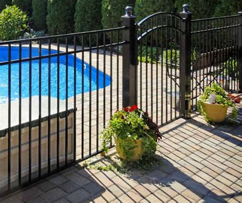 Aluminum pool fences are affordable and good looking. A black metal ...