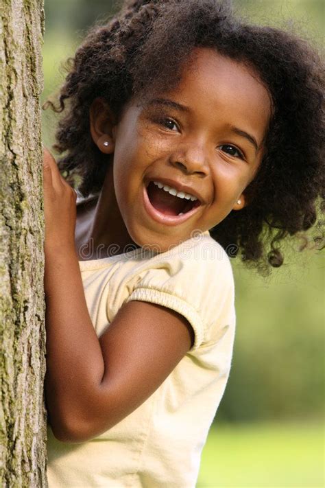 African American Child. Happy African American child playing in a park ...