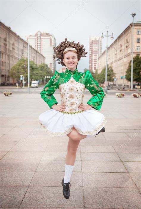 Young woman in irish dance dress and wig dancing Stock Photo by ...