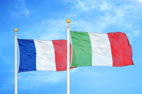 France and Italy Two Flags on Flagpoles and Blue Cloudy Sky Stock Image ...