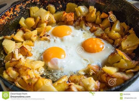 Fried Potatoes with Eggs in Pan Stock Photo - Image of kitchen, cooking ...