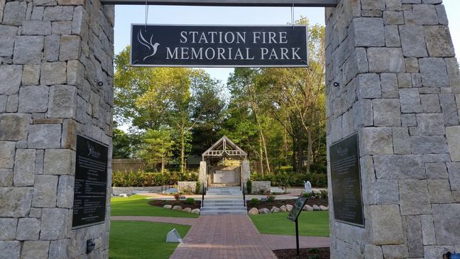 The Station Fire Memorial Park at the Cowesett Avenue site features a courtyard, gardens and a walkway.  (WJAR)