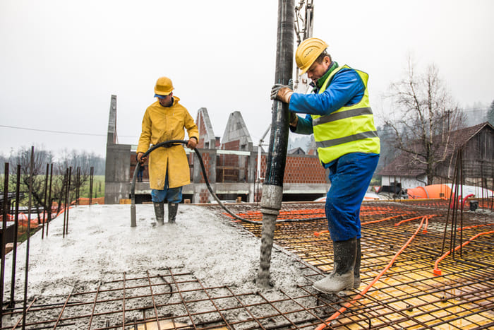 pouring cement on the new house floor