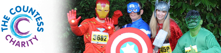 Four volunteers and fundraisers pose for a group picture dressed up as characters from the Marvel Comics.