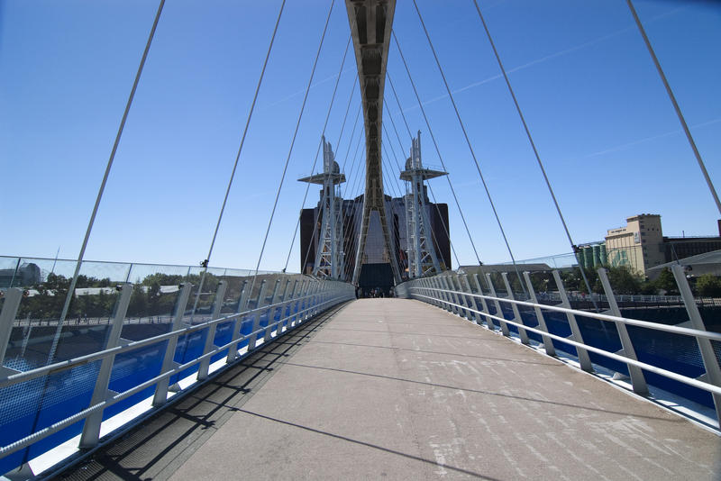 a view walking across the lift bridge at salford quays, manchester, uk