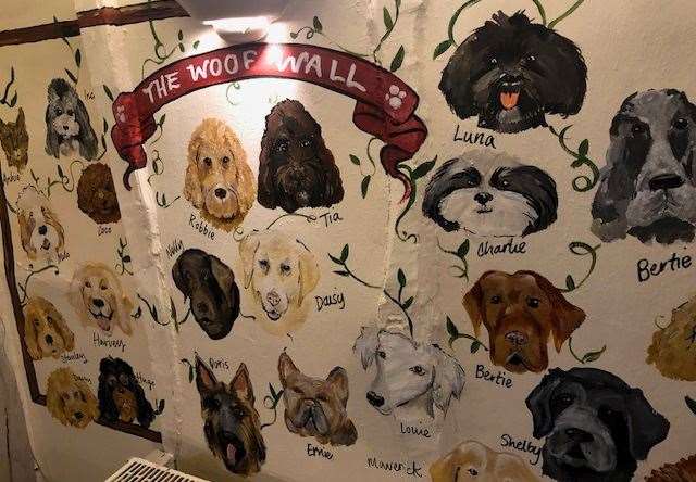 The Woof Wall, picturing the pub's four-legged friends, is a main feature and proves just how welcome dogs are here