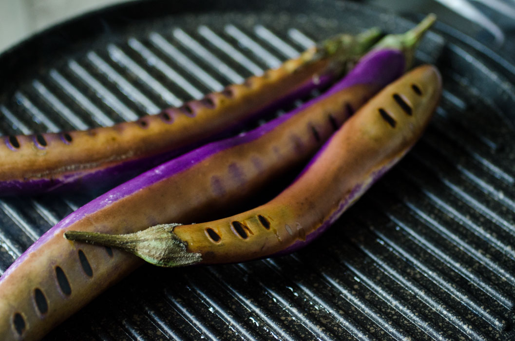 Chinese eggplant hot dogs with mustard mayo, herbed oil and quick pickled onions // vegan