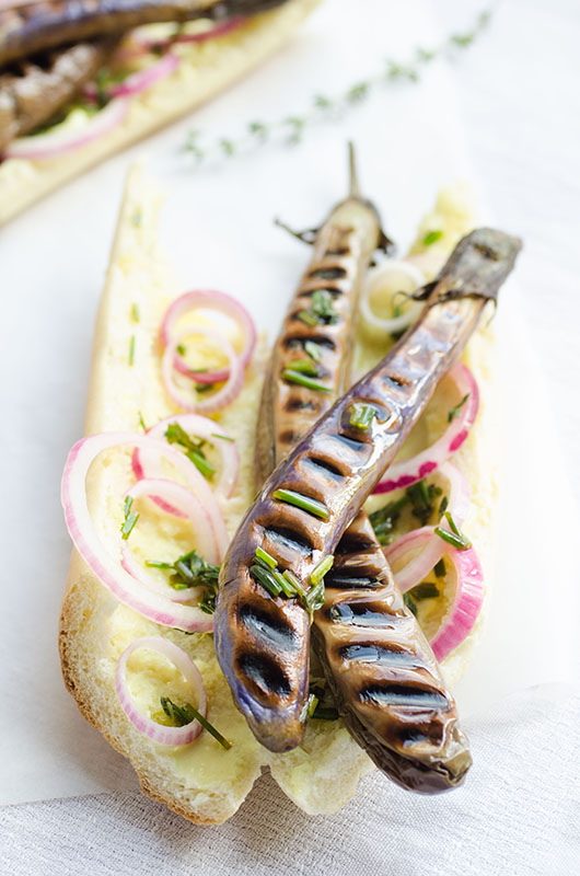 Chinese eggplant hot dogs with mustard mayo, herbed oil and quick pickled onions // vegan