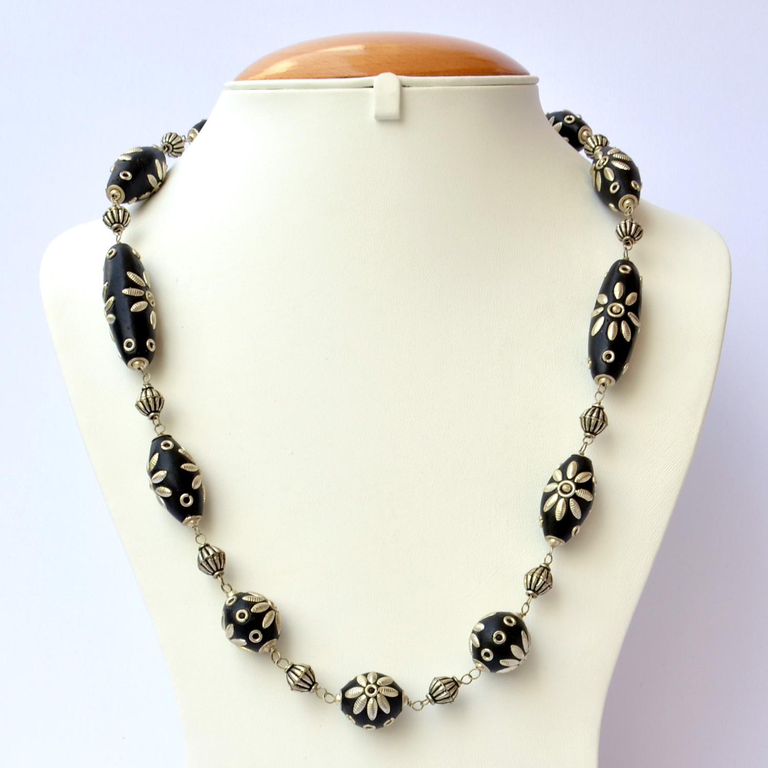 Handmade Necklace with Black Beads having Metal Flower Design Maruti