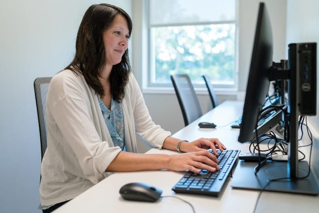 Care Team member at computer