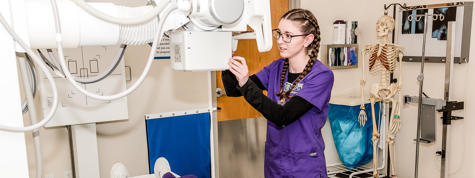 radiography student practices with MRI machine