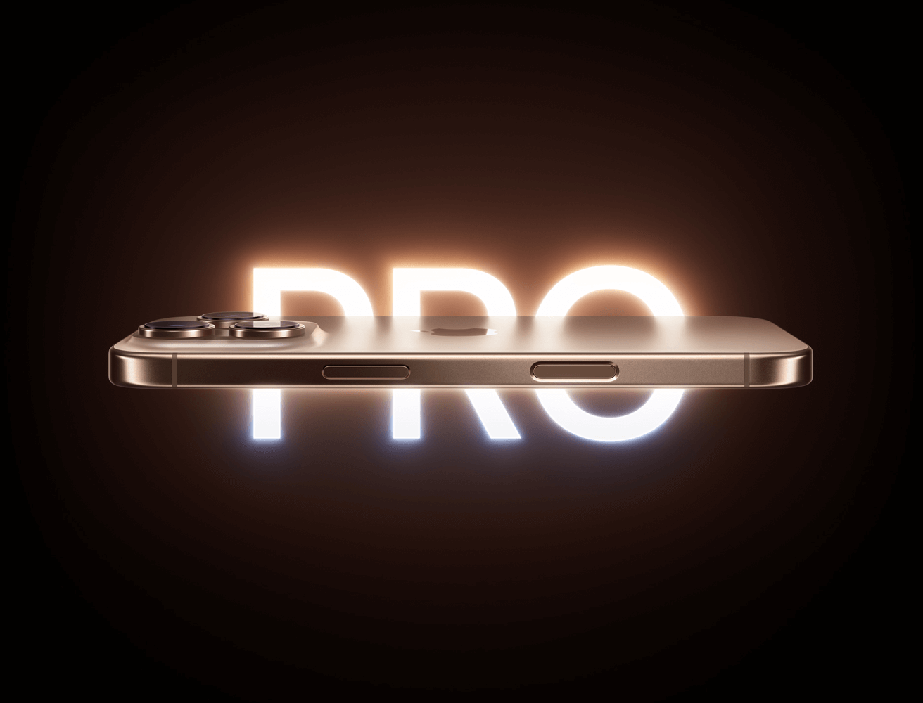 Horizontal view of the new iPhone 16 Pro in Desert Titanium colour. Text on image: Pro.